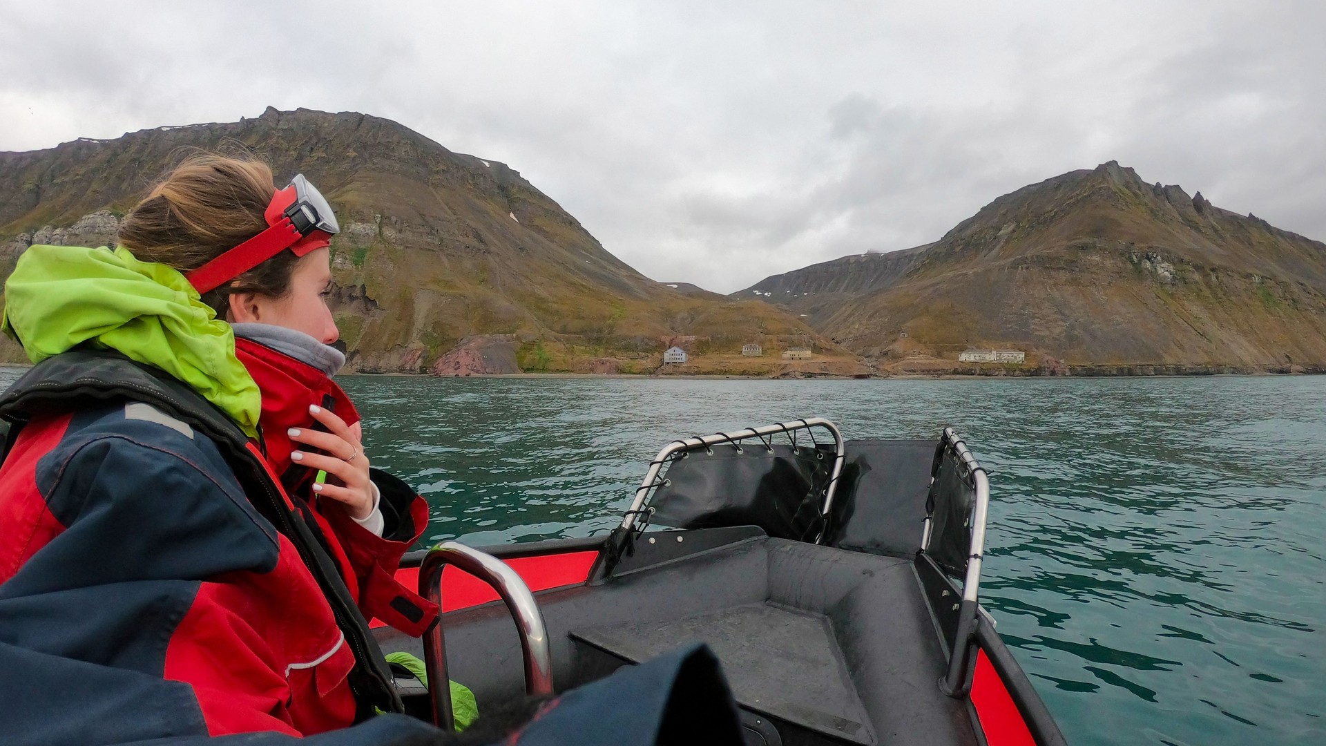 Traveler woman in an Arctic rib boat safari in Longyearbyen, Svalbard